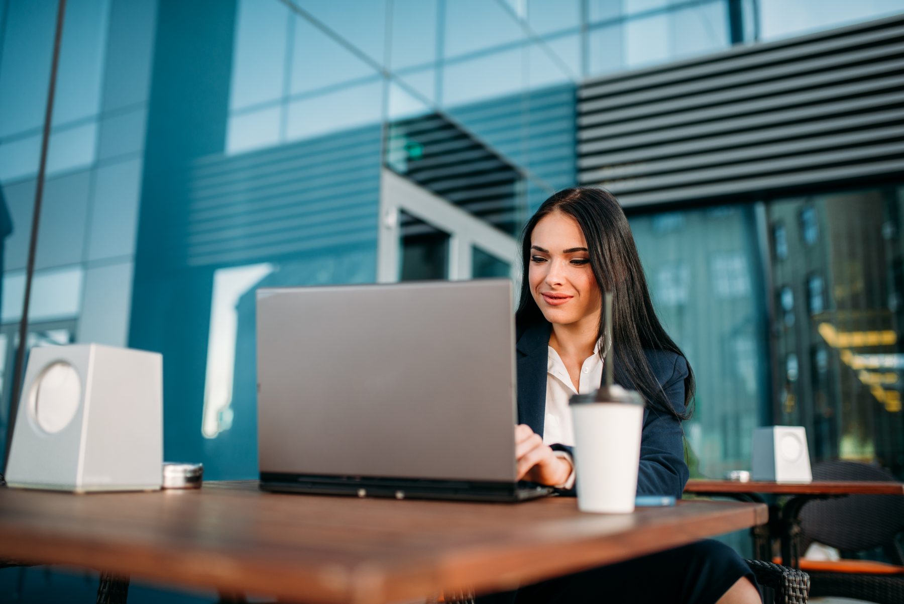 Businesswoman works on a laptop in the office on digital asset management systems.